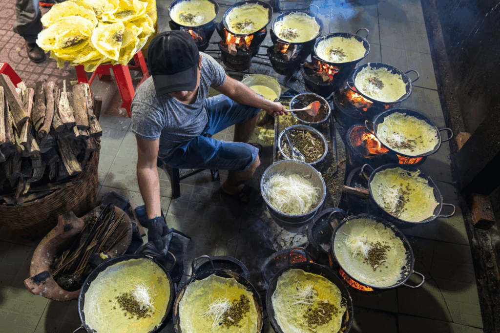 Vietnamese Man Cooking Banh Xeo 