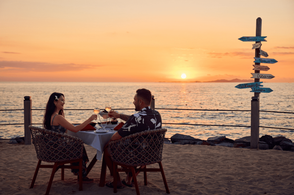 Couple ocean-side dining at Radisson Blu Resort, Fiji