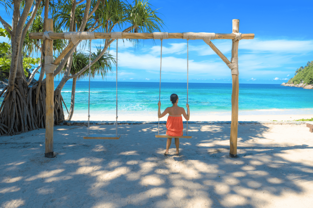 Lady on swing at Tri-Trang Beach (Phuket Marriott Resort & Spa, Merlin Beach)