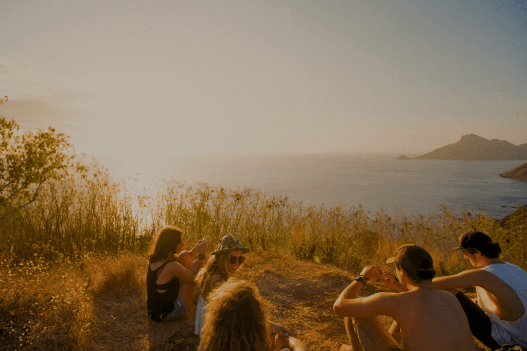 Group of friends doing a sunset hike in the Yasawa Islands, Fiji